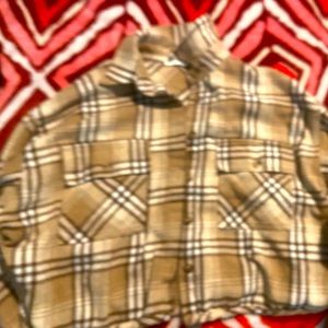 A beige plaid brown sweater